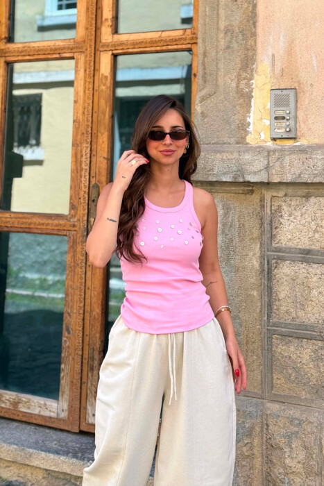 KANATJERE NJE NGJYRESHE ME DETAJIN E BUTONAVE PER FEMRA NE NGJYRE ROZE - 1