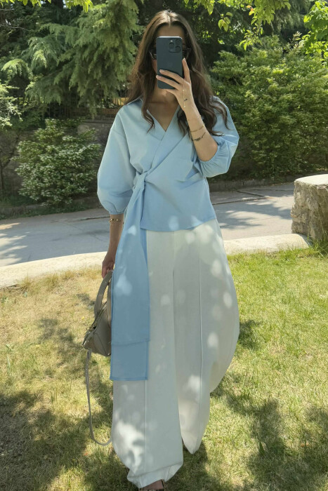 KËMISHE NJË NGJYRËSHE ME LIDHSE PËR FEMRA NË NGJYRËN BLU E ZBARDHUR - 2