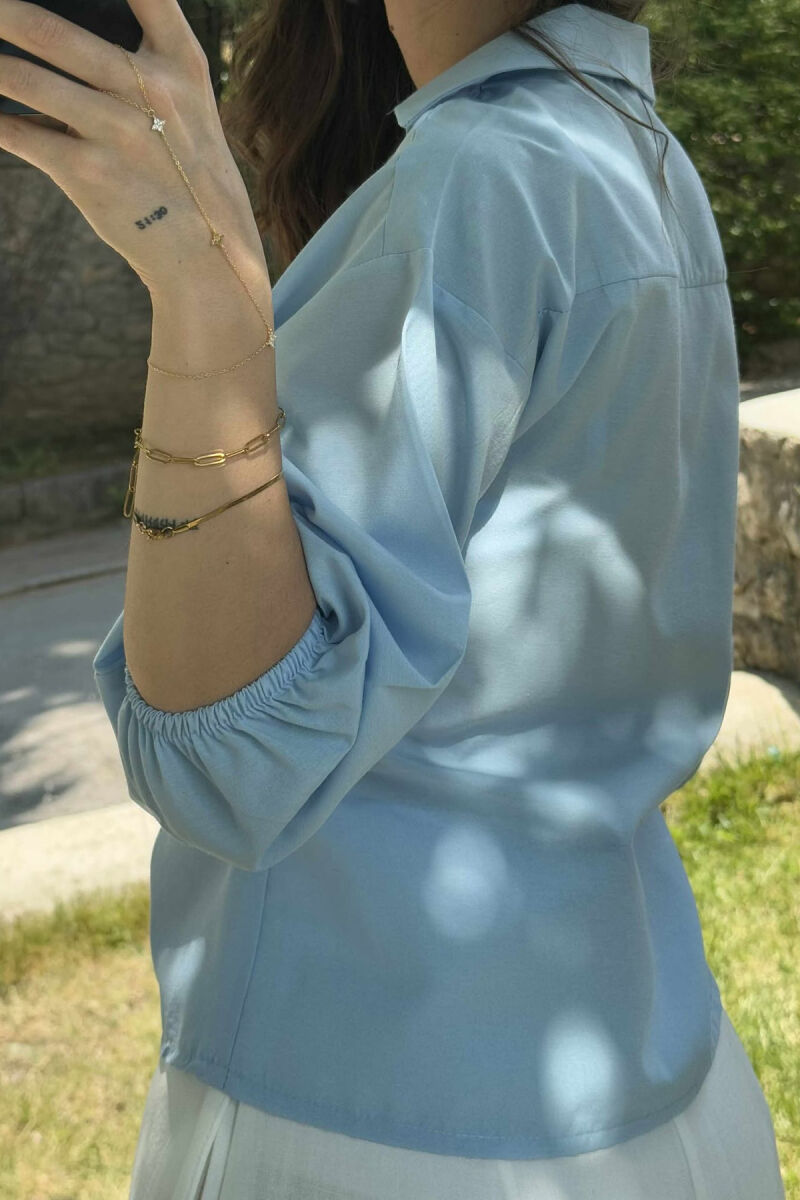 KËMISHE NJË NGJYRËSHE ME LIDHSE PËR FEMRA NË NGJYRËN BLU E ZBARDHUR - 3