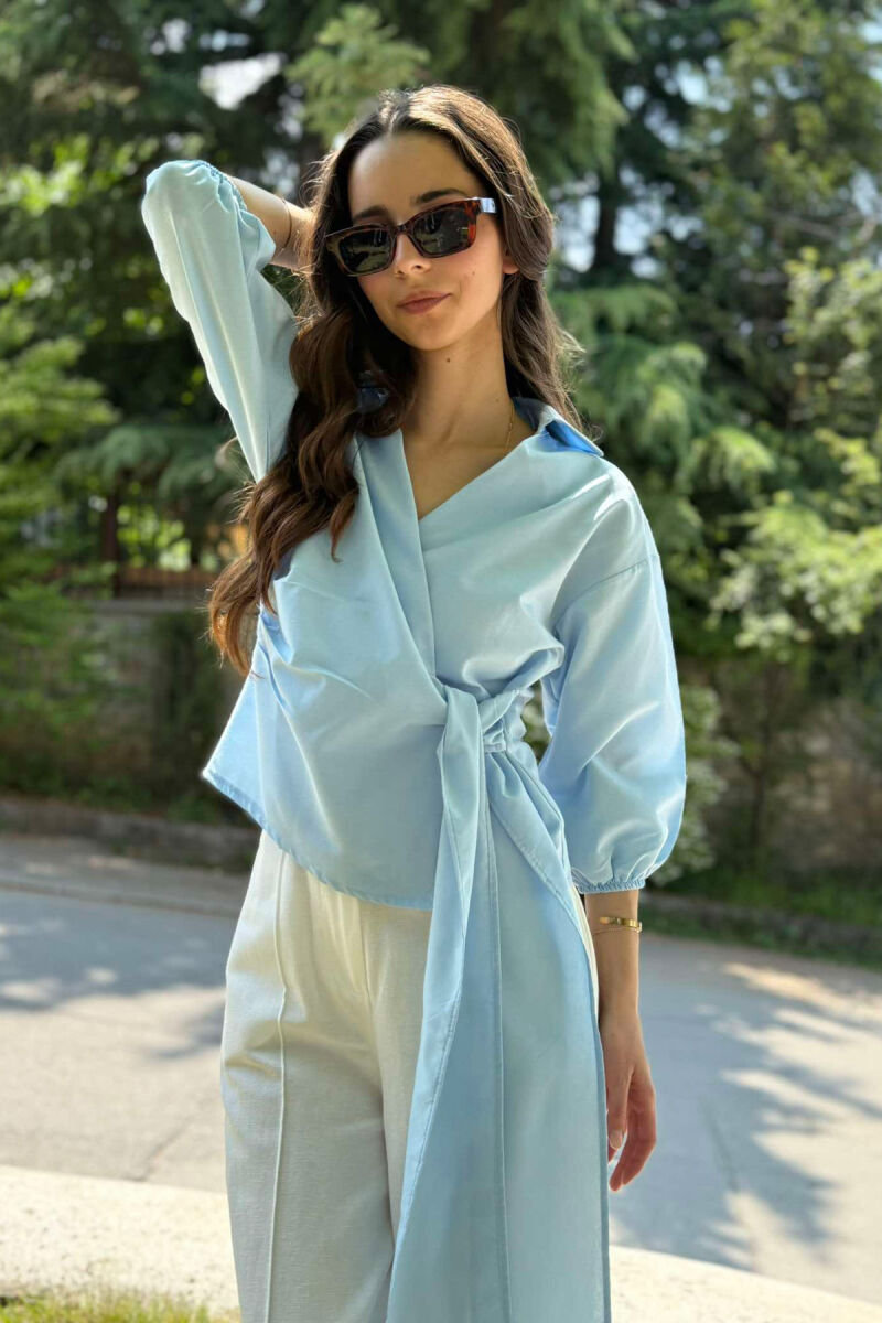 KËMISHE NJË NGJYRËSHE ME LIDHSE PËR FEMRA NË NGJYRËN BLU E ZBARDHUR - 5