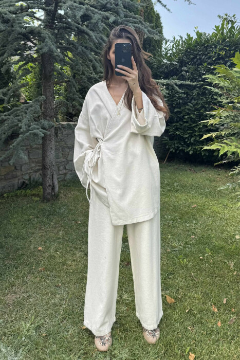 SET NJË NGJYRËSH ME LIDHSE PULOVËR+PANTALLONA PËR FEMRA NË NGJYRËN KREM - KLAUDIO FASHION