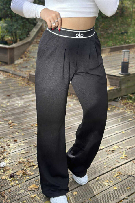 PANTALLONA ME SHKRIM ALO ME BEL ELASTIK PËR FEMRA NË NGJYRË TË ZEZË - 1