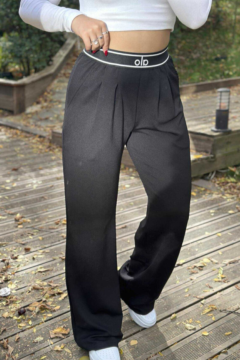 PANTALLONA ME SHKRIM ALO ME BEL ELASTIK PËR FEMRA NË NGJYRË TË ZEZË - 1