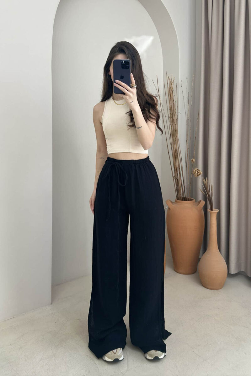 PANTALLONA NJË NGJYRËSHE ME DETAJIN E LIDHSES PËR FEMRA NË NGJYRËN E ZEZË - 1