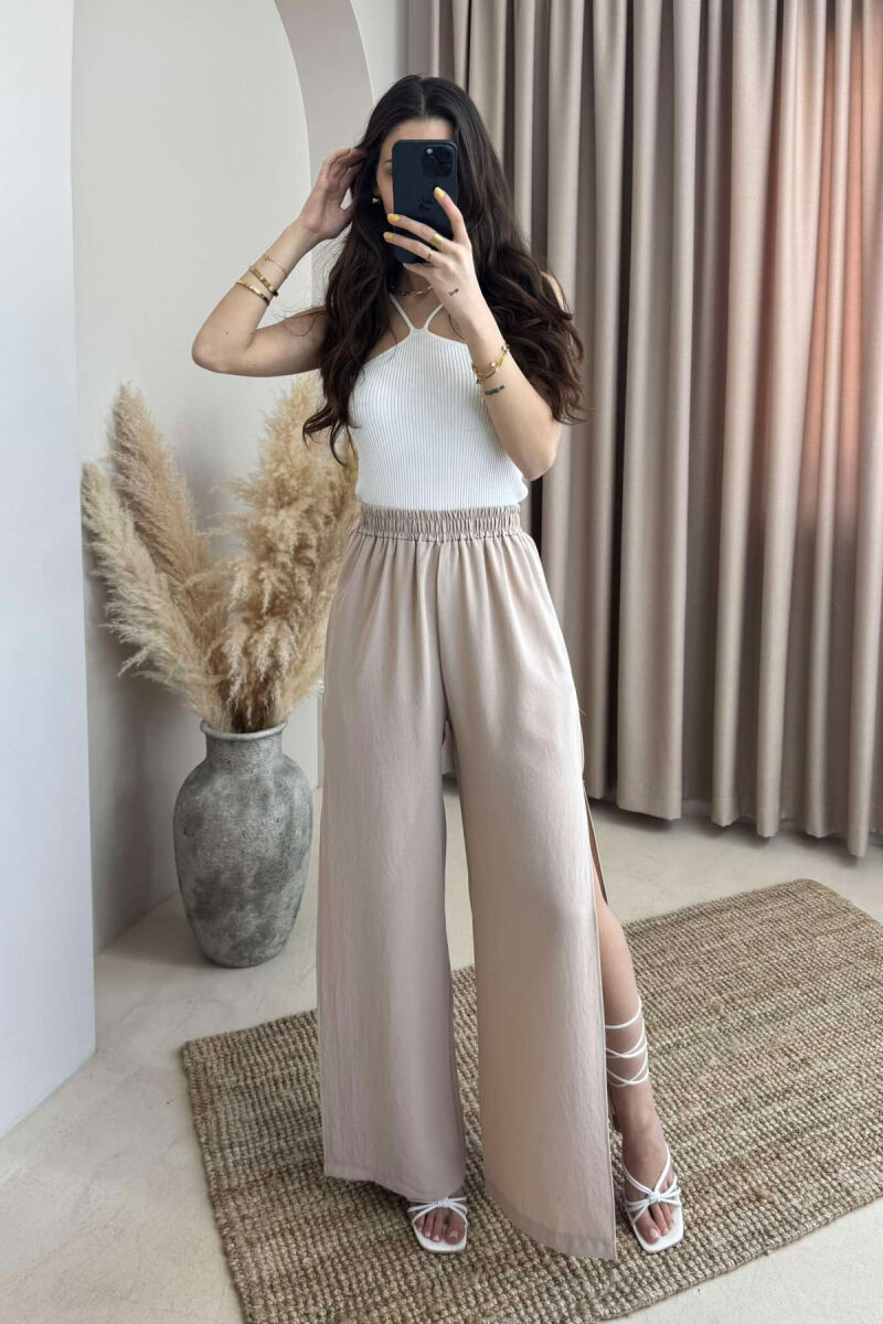 PANTALLONA NJË NGJYRËSHE TË GJERA PËR FEMRA NË NGJYRËN BEZHË - 1