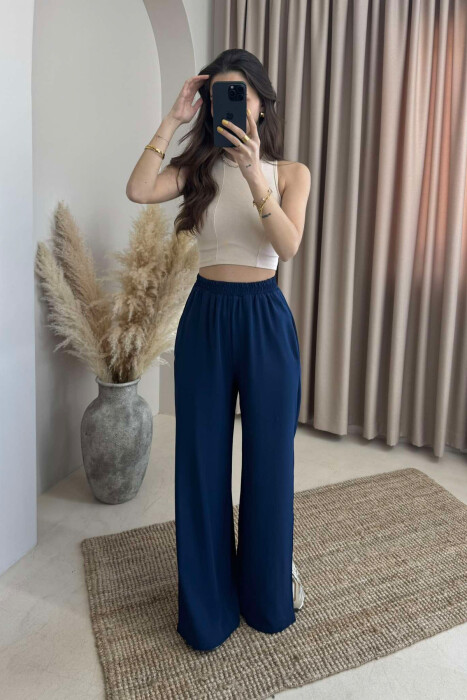 PANTALLONA NJË NGJYRËSHE TË GJERA PËR FEMRA NË NGJYRËN BLU E ERRËT - 4