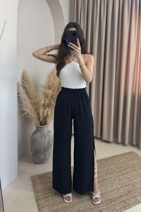 PANTALLONA NJË NGJYRËSHE TË GJERA PËR FEMRA NË NGJYRËN E ZEZË - 1