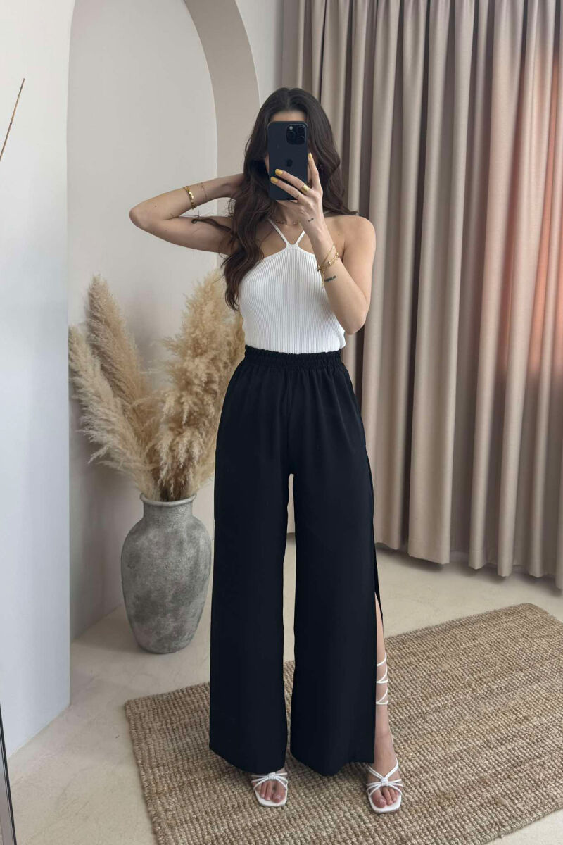 PANTALLONA NJË NGJYRËSHE TË GJERA PËR FEMRA NË NGJYRËN E ZEZË - 1