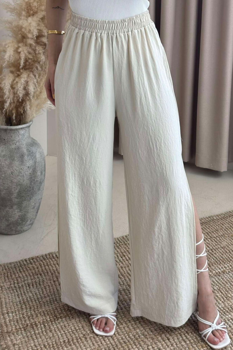 PANTALLONA NJË NGJYRËSHE TË GJERA PËR FEMRA NË NGJYRËN KREM - 3