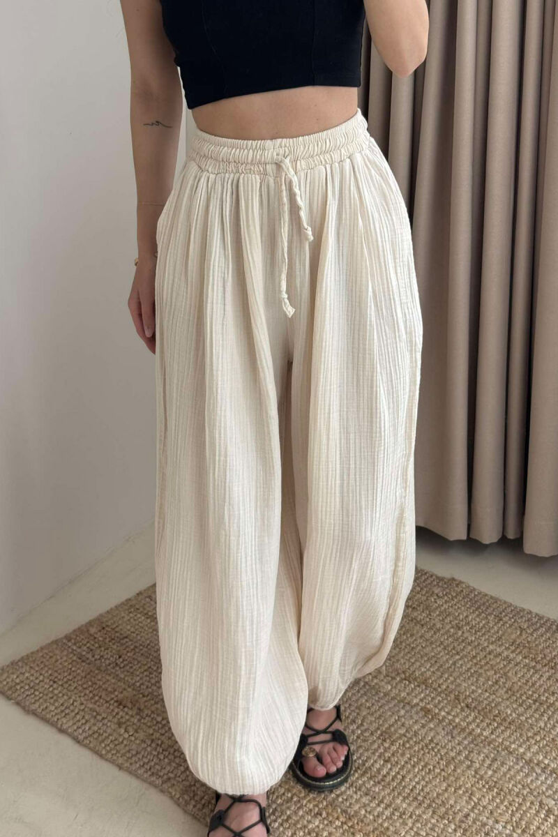 PANTALLONA NJË NGJYRËSHE TË THJESHTA PËR FEMRA NË NGJYRËN BEZHË - 3