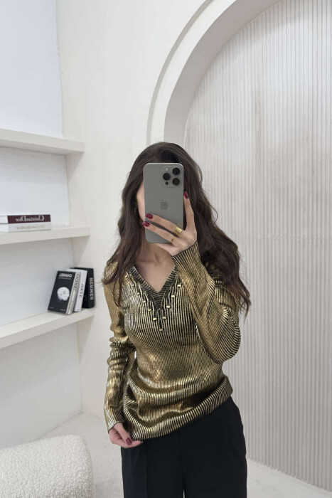 TRIKO E SHNDRITSHME PËR FEMRA NË NGJYRËN GOLD 