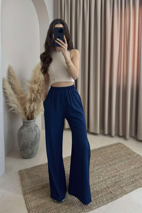 PANTALLONA NJË NGJYRËSHE TË GJERA PËR FEMRA NË NGJYRËN BLU E ERRËT 