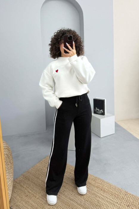 TUTA ME BEL ELASTIK DHE ME DETAJIN E LIDHSEVE PER FEMRA NE NGJYRE TE ZEZE - 2