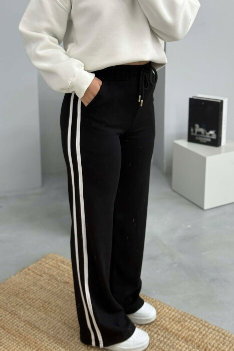 TUTA ME BEL ELASTIK DHE ME DETAJIN E LIDHSEVE PER FEMRA NE NGJYRE TE ZEZE - 4