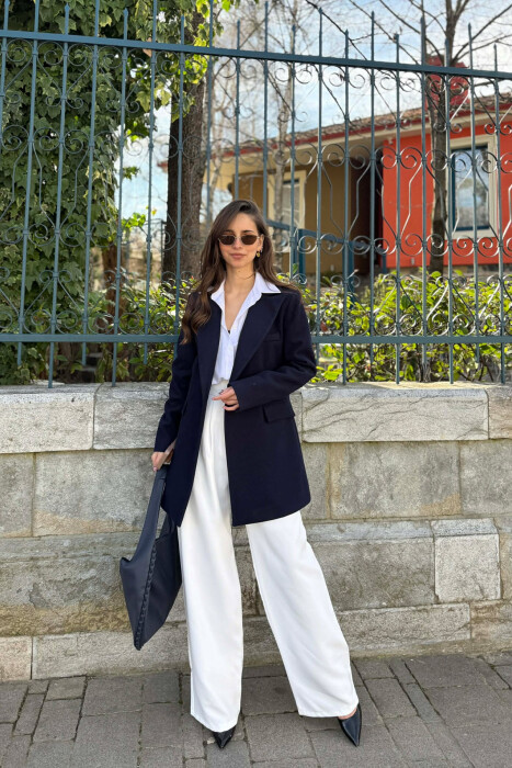 XHAKETE E THJESHTE NJE NGJYRESHE ME BUTONA PER FEMRA NE NGJYRE BLU TE ERRET - 2